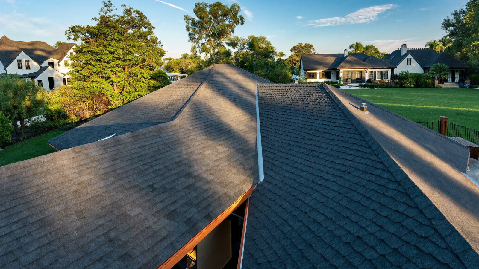 Completed architectural shingle roof in warm afternoon light
